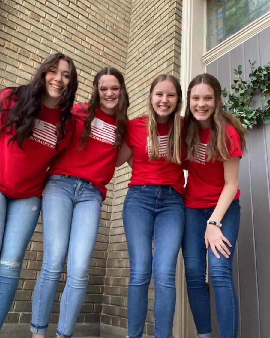 Four Troubadours students in red shirts