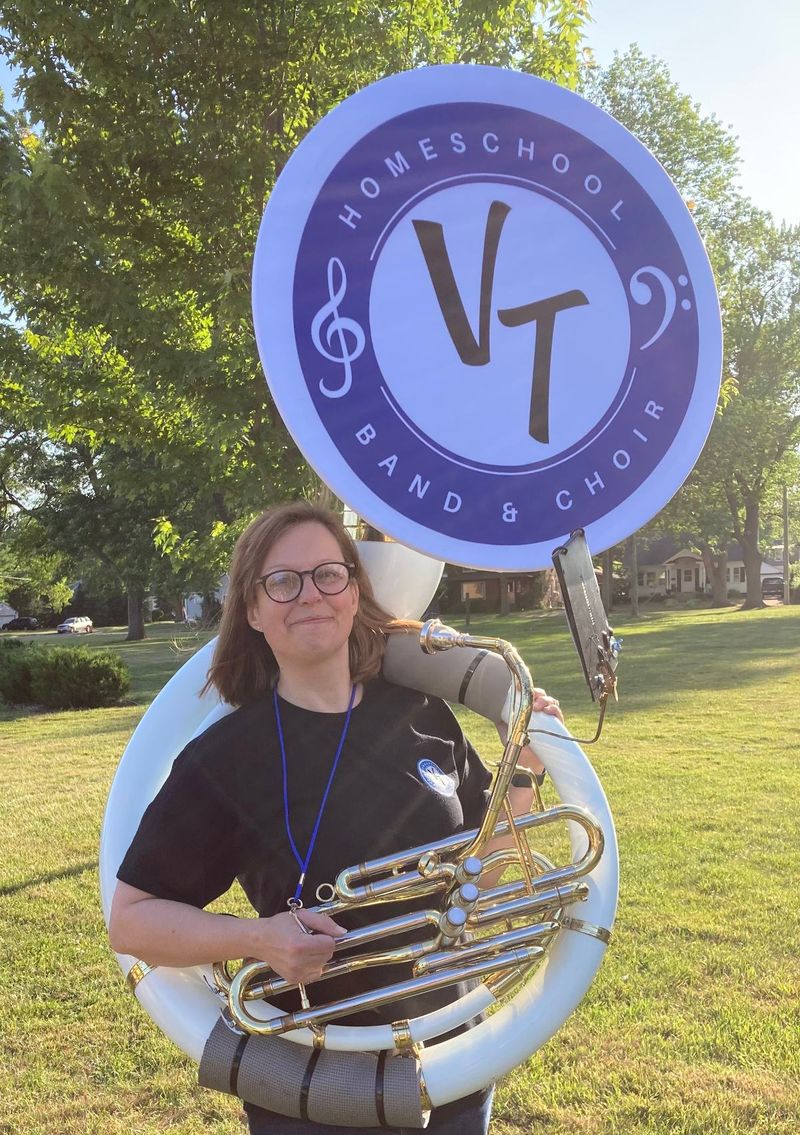 Cathy LaFrombois holding a sousaphone