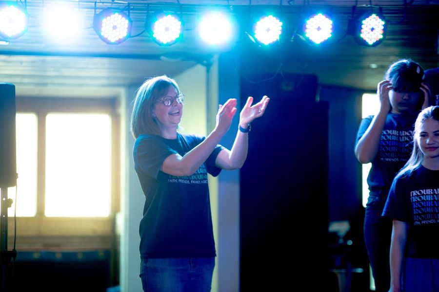 Cathy LaFrombois with Troubadours students