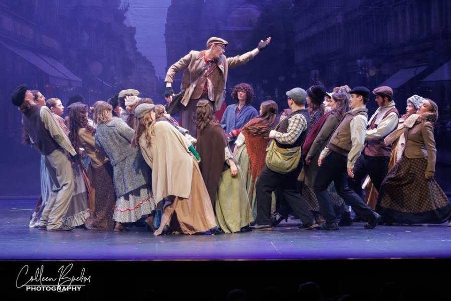 Musical theater cast on stage