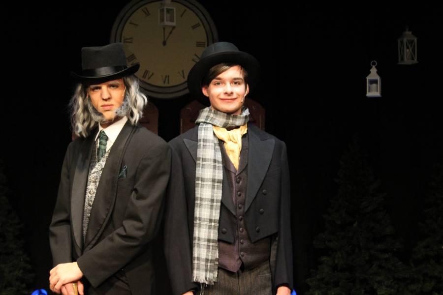 Two actors in costume from A Christmas Carol