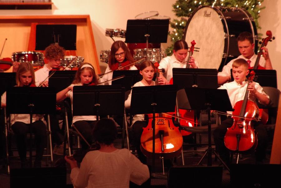 Cello and violin students in concert